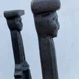 Pair of cast iron chenets with stylized faces High Epoch SEVENTEENTH century