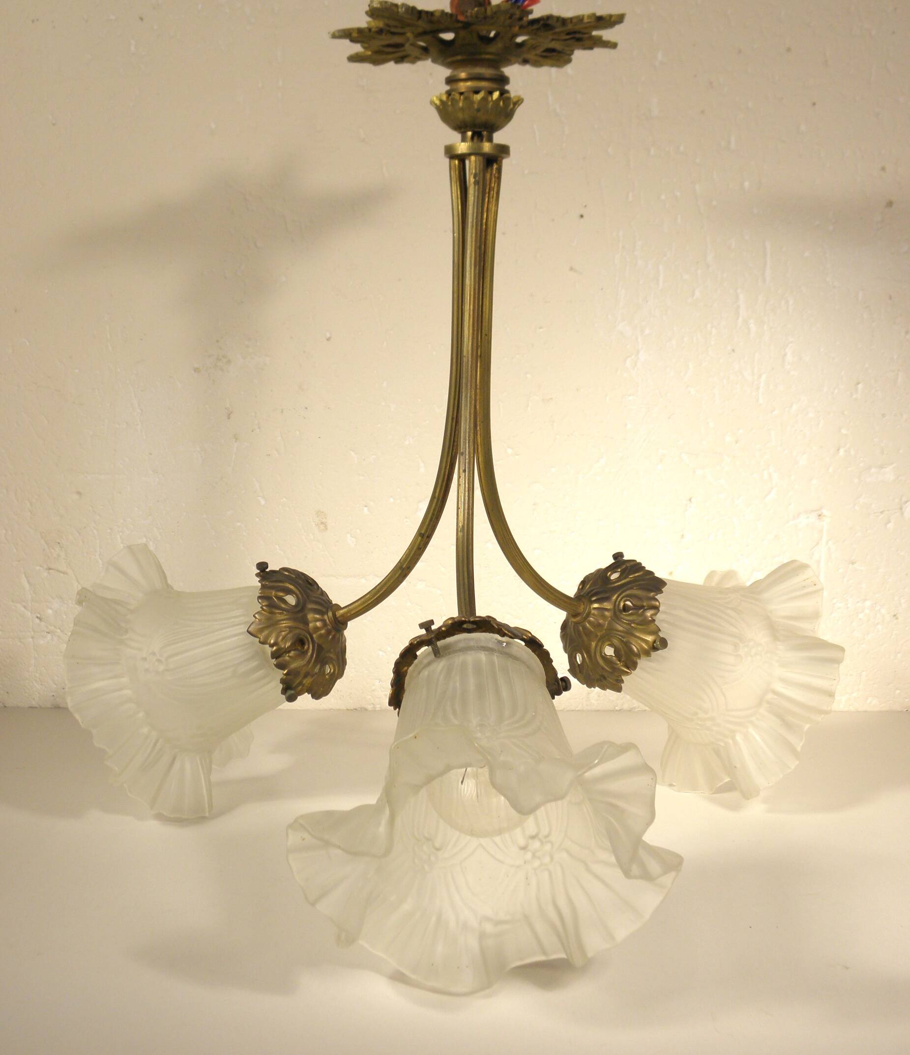 Chandelier with three brass and glass lights