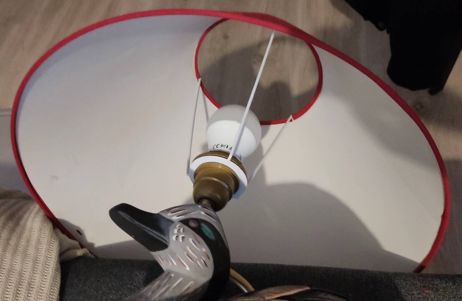 Decorative table lamp with a sculpted duck-shaped base and painted finish.