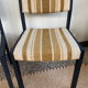 2 wooden chairs and vintage fabric