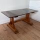 Pine coffee table with smoked glass top.