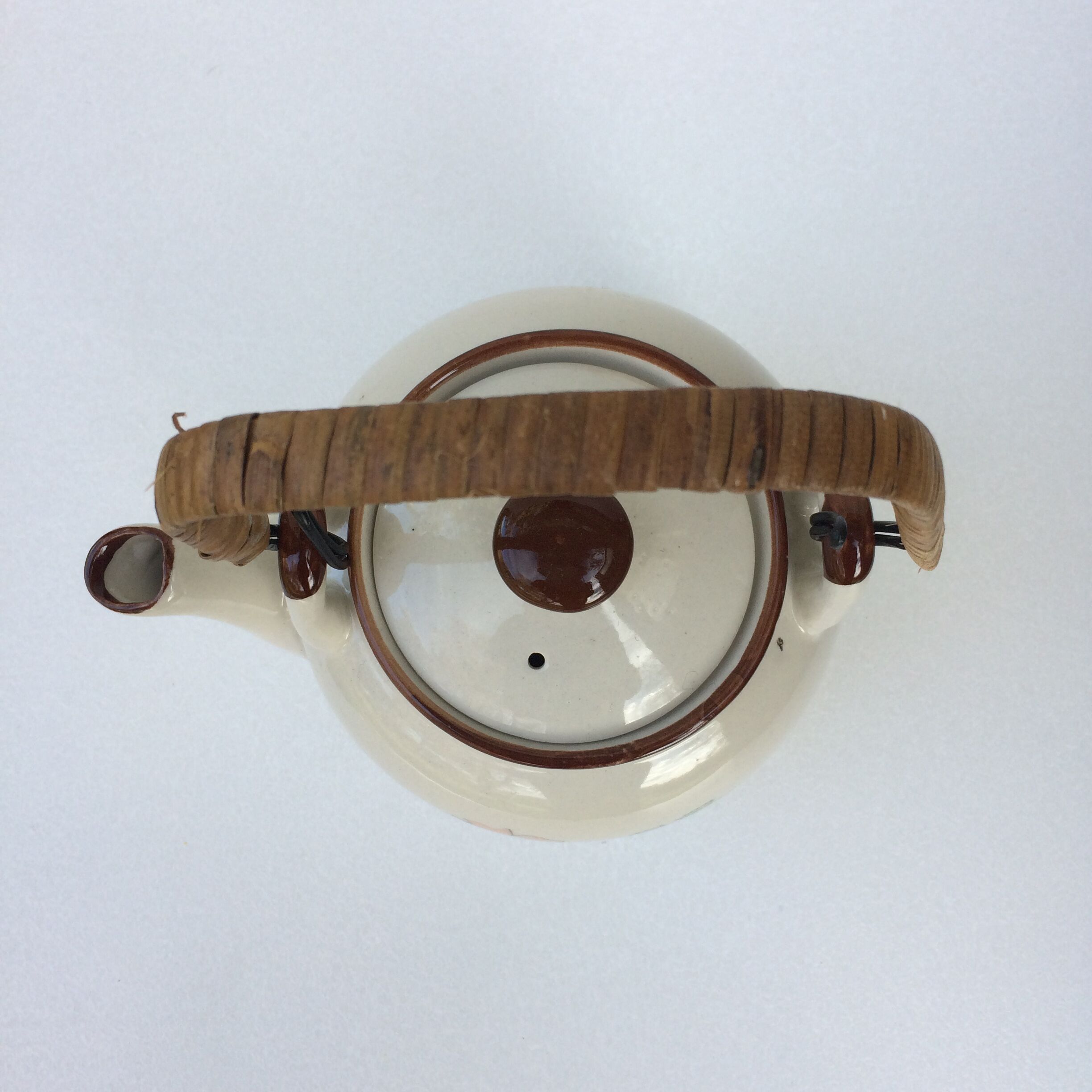 Vintage teapot with wicker handle