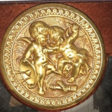 Mirror in gilded bronze and mahogany wood Medallion porcelain decoration.