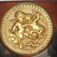 Mirror in gilded bronze and mahogany wood Medallion porcelain decoration.
