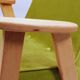 Fauteuil vintage en velours vert poire, bois naturel huilé.