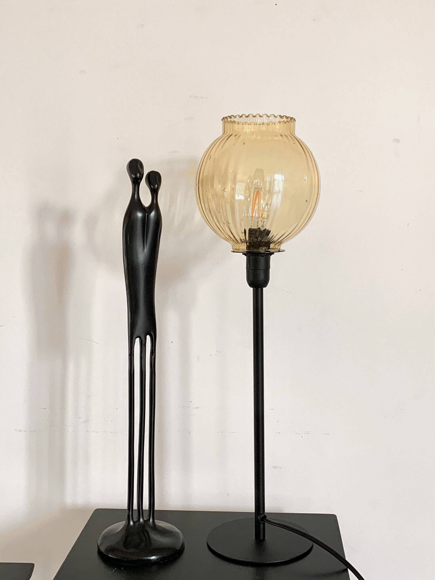 Table lamp with an antique gold glass lampshade