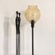 Table lamp with an antique gold glass lampshade