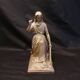 Statuette of a woman in gilded cast iron (Joan of Arc?)