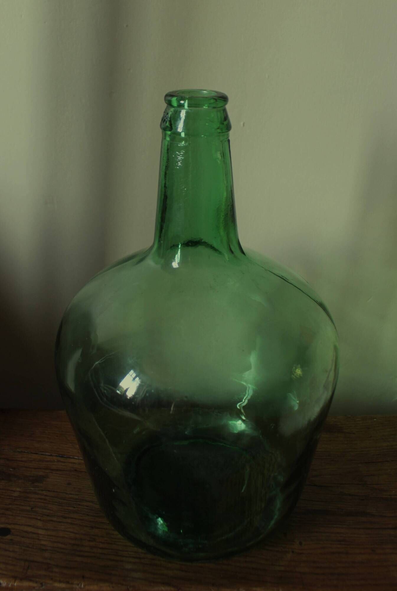 Dame Jeanne carboy from the Viresa collection in dark green glass