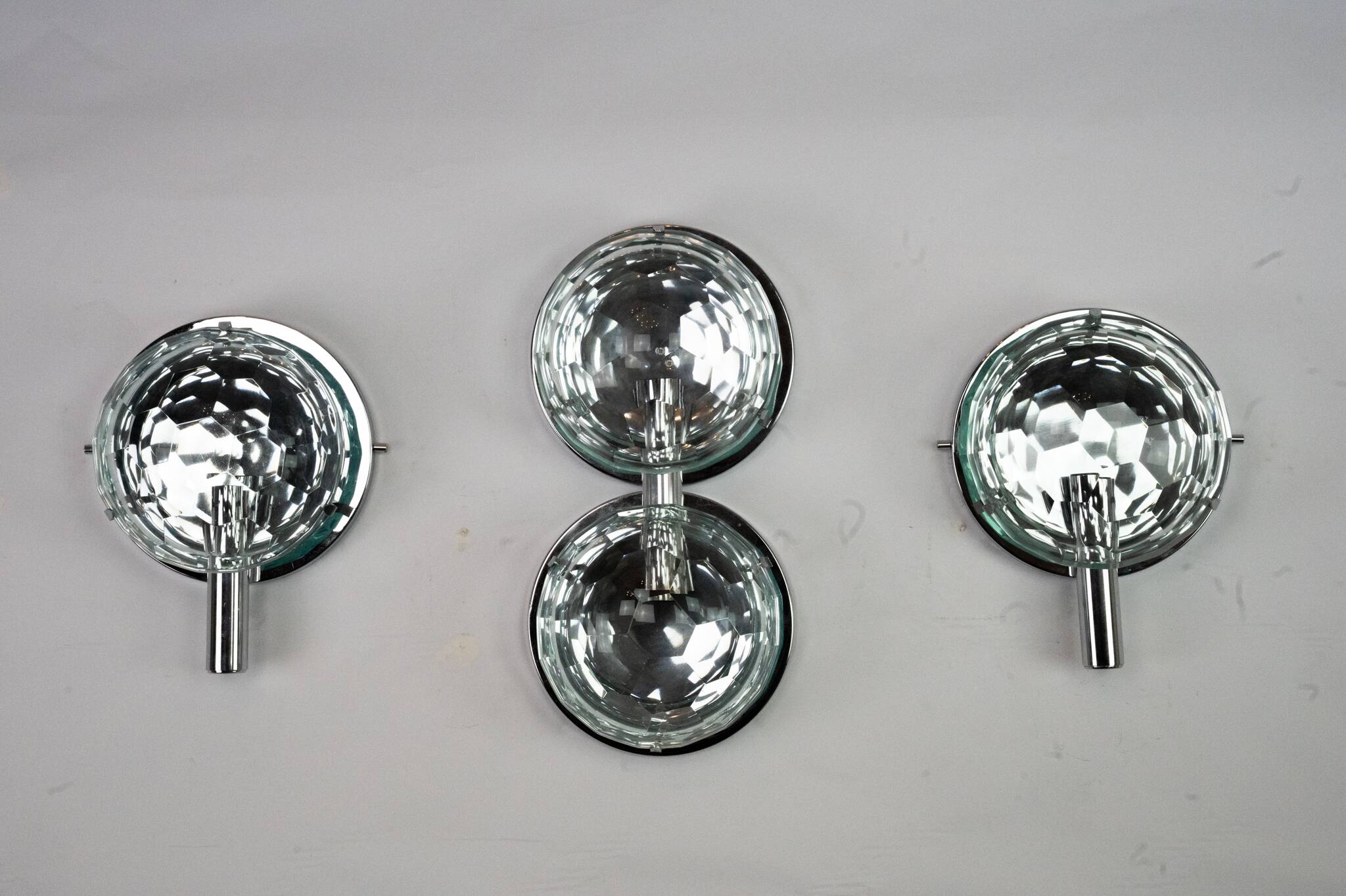 Set of three Cristal Art sconces in chrome and cut glass. Italy 1970s