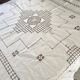 Net-style embroidered cotton tablecloth.