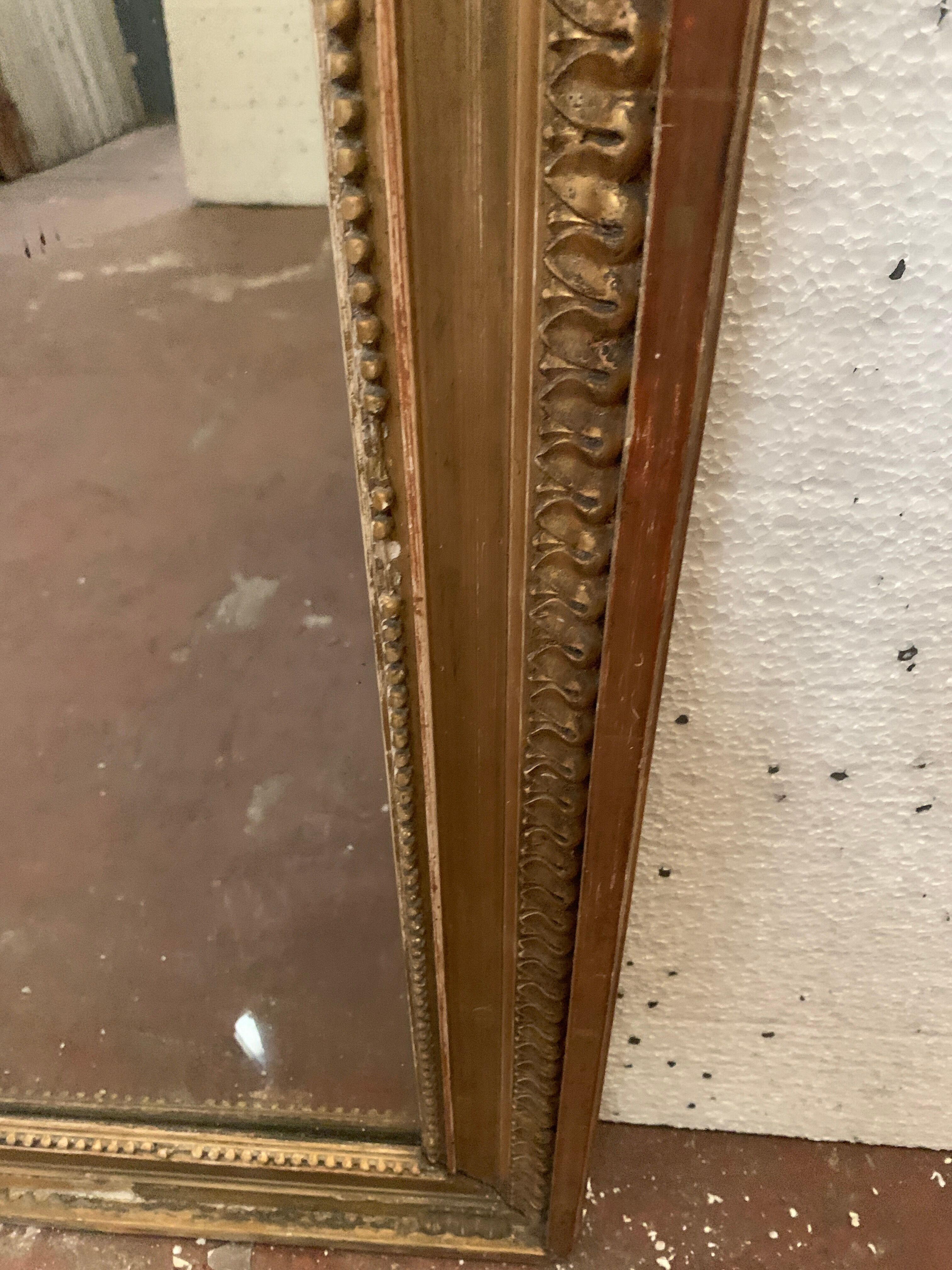 Louis XVI style mirror in wood and gilded stucco XIX century