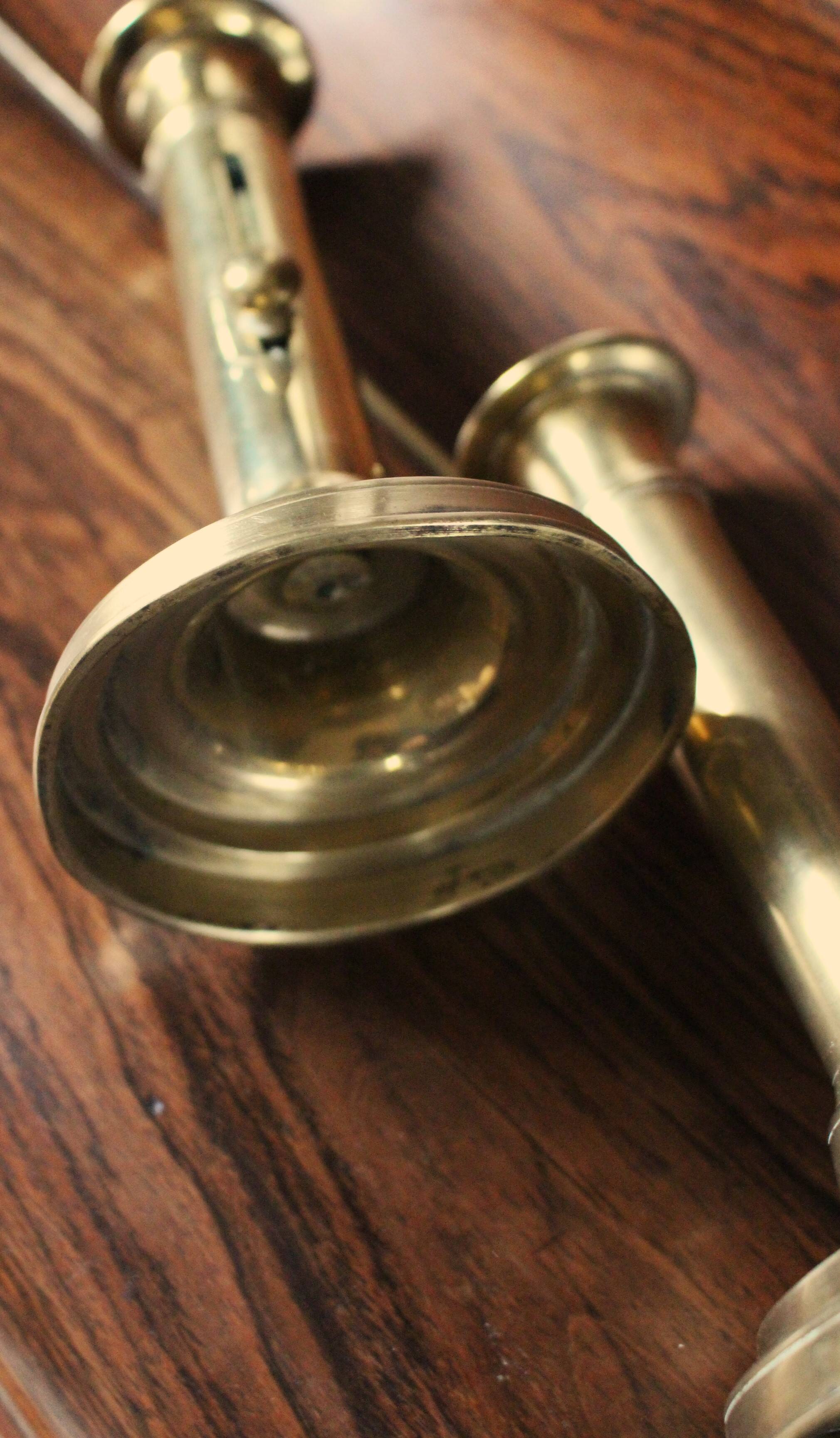 Pair of brass push-button candlesticks