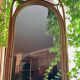 Arched Spanish wall mirror in rattan and bamboo, 1960s.