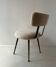 Low seat in metal and white boucle fabric.