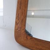 Mid-century modern sculptural wall mirror in stained oak, glass, Glas & Trä 1959