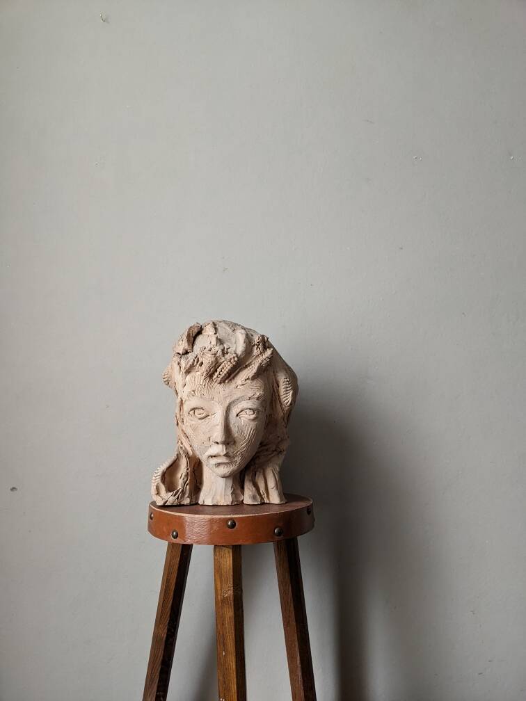 Handmade clay terracotta sculpture head decoration workshop