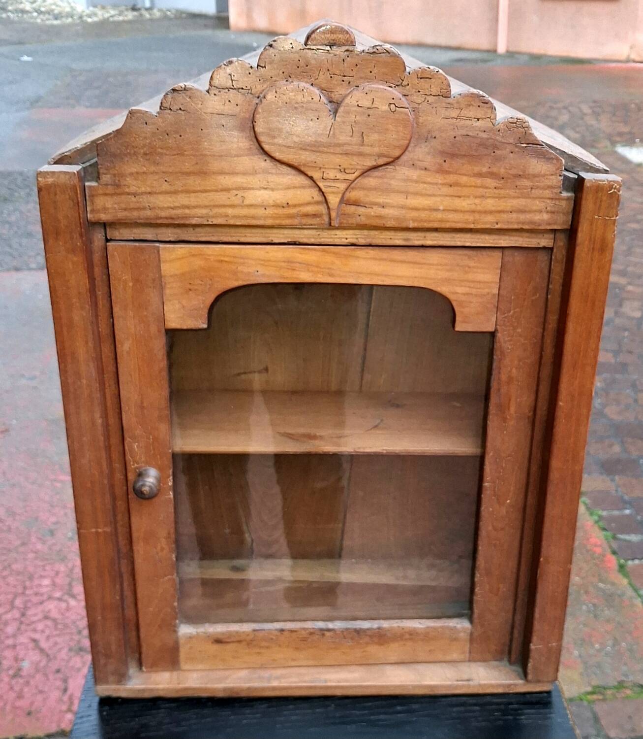 Showcase of popular art in solid wood, carved heart.