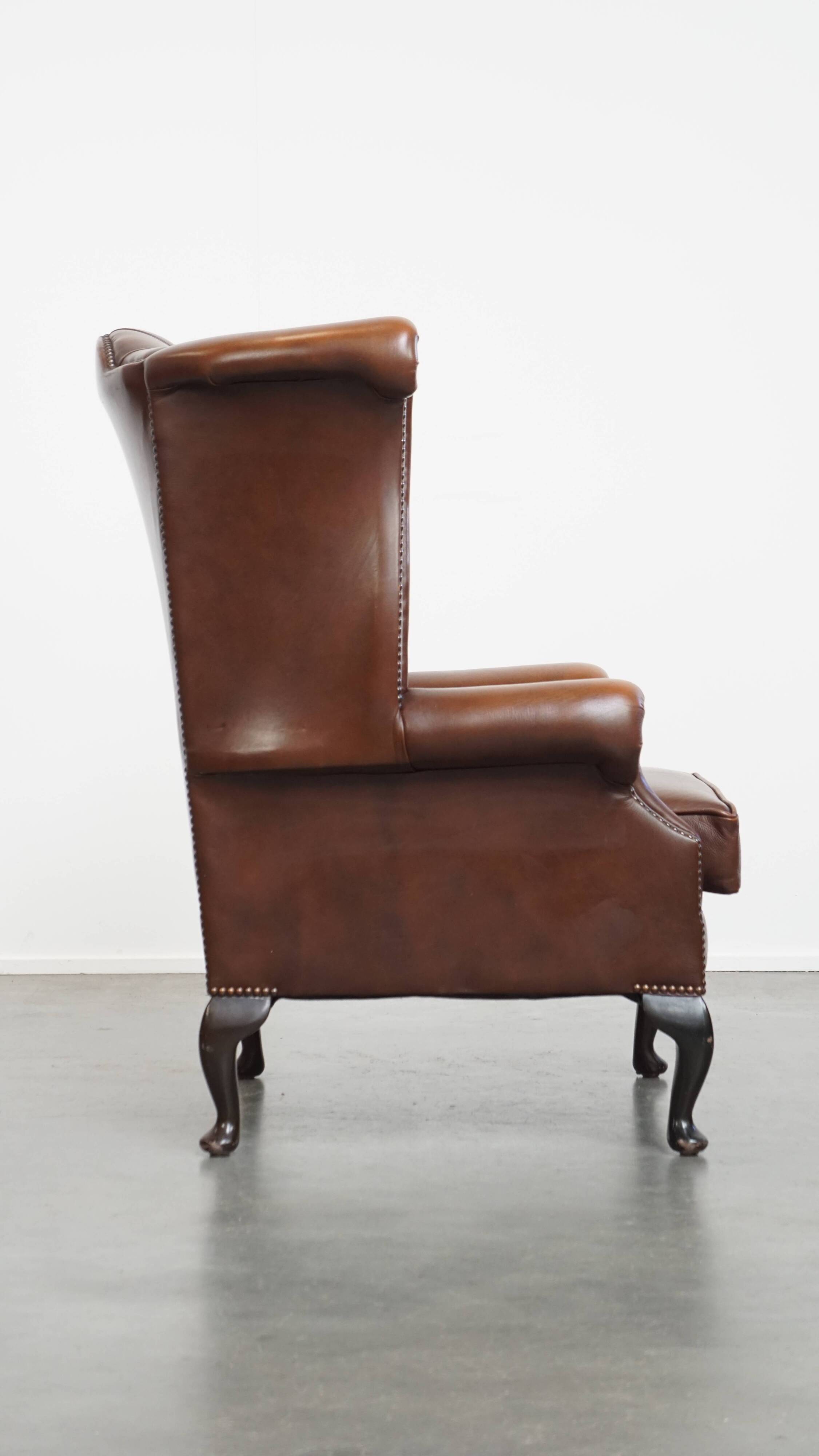 Chesterfield wing chair in dark brown English cowhide