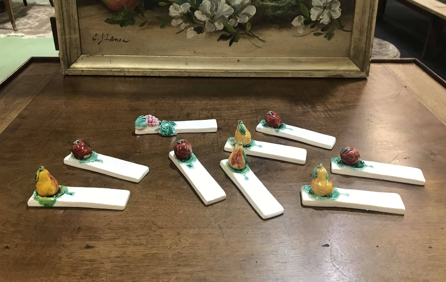 Set of 9 fruit-decorated knife rests from the 1930s.