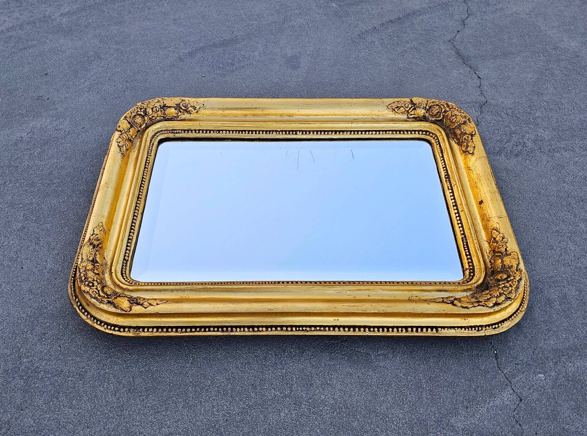 Large Biedermeier gilded mirror in faceted wood, circa 1840.