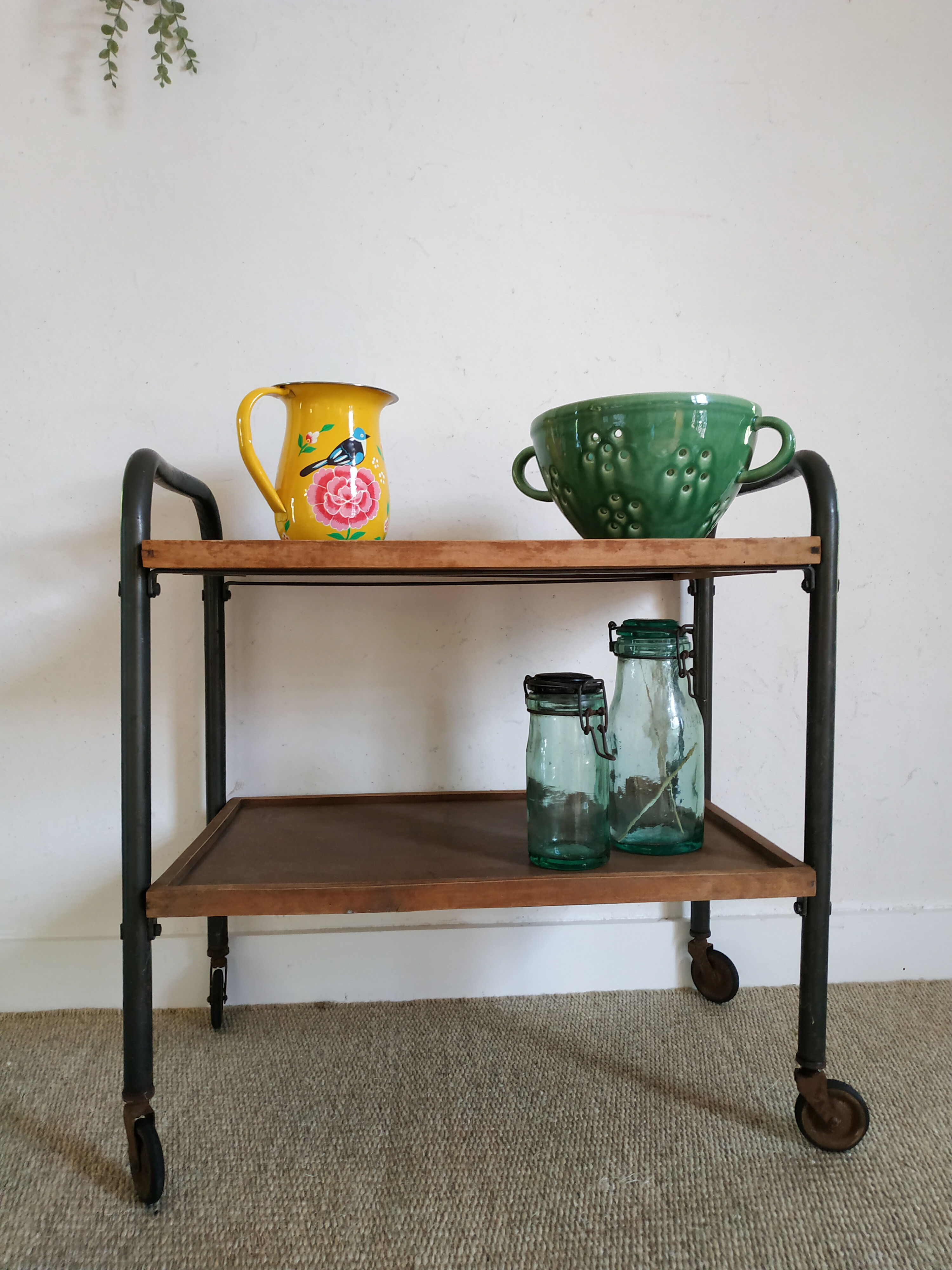 Serving table on metal wheels and antique wood