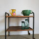 Serving table on metal wheels and antique wood