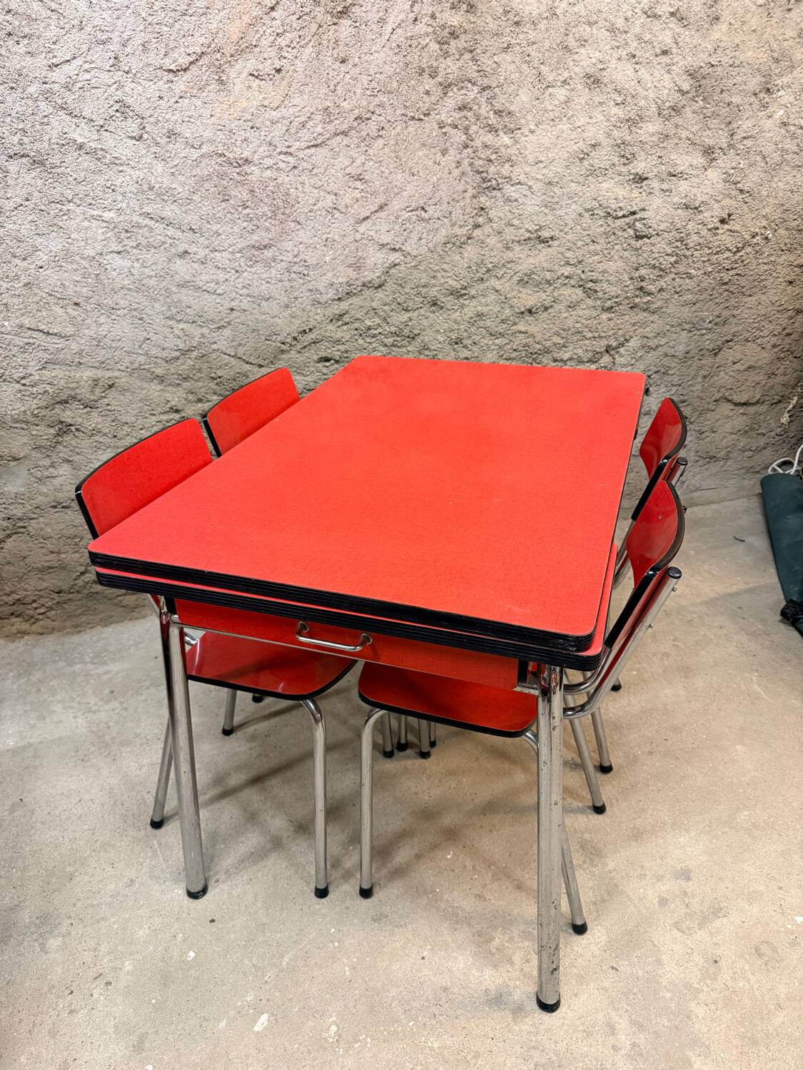 4 red Formica chairs with a 1970s table