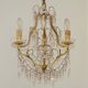 French gilt bronze three-light cage chandelier with pink and clear beaded swags.