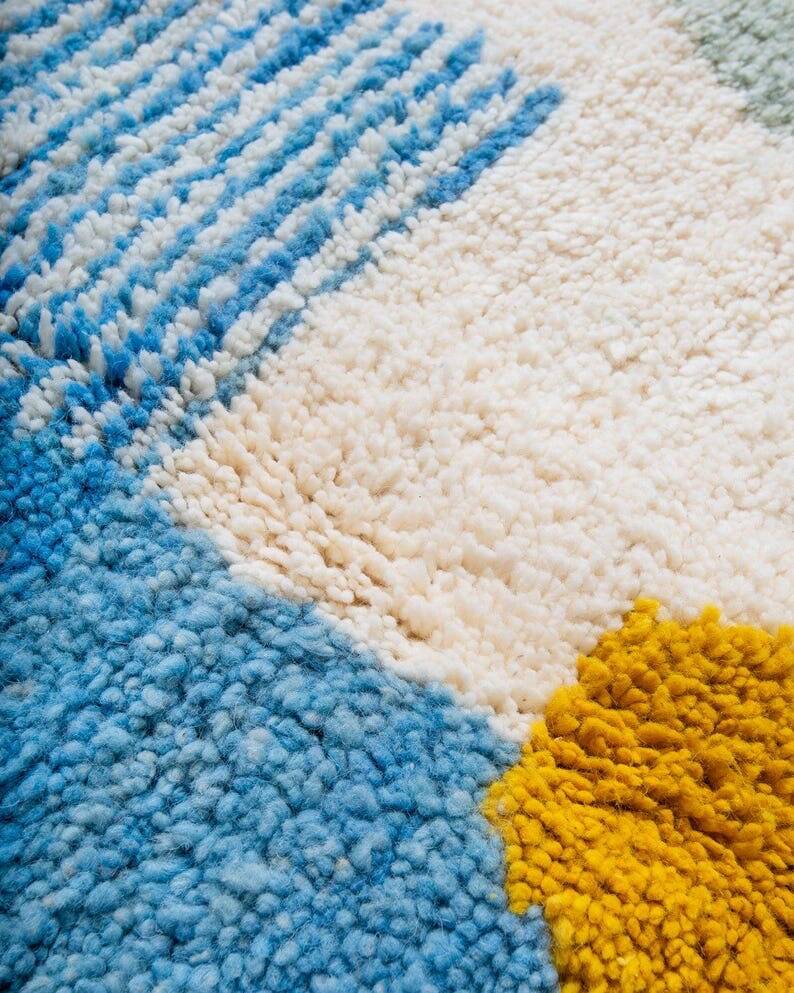 Wool rug with colourful patterns, size 150/250 cm.