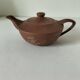 Japanese teapot in red clay engraved with integrated filter.