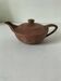 Japanese teapot in red clay engraved with integrated filter.