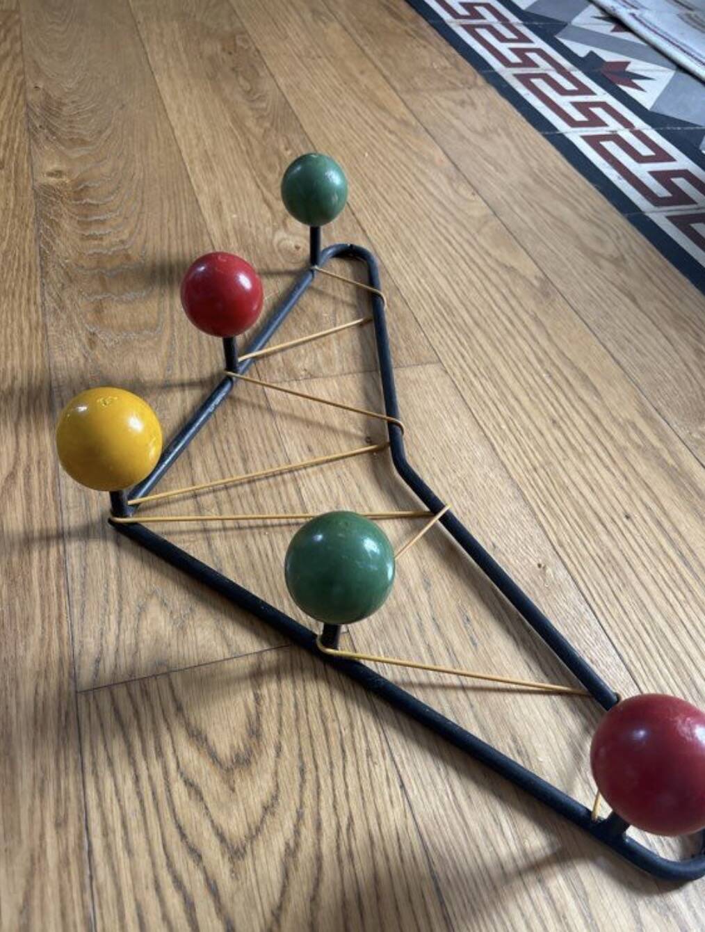 Vintage coat rack in the style of Roger Ferraud.