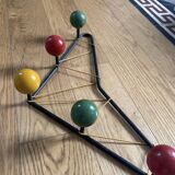 Vintage coat rack in the style of Roger Ferraud.