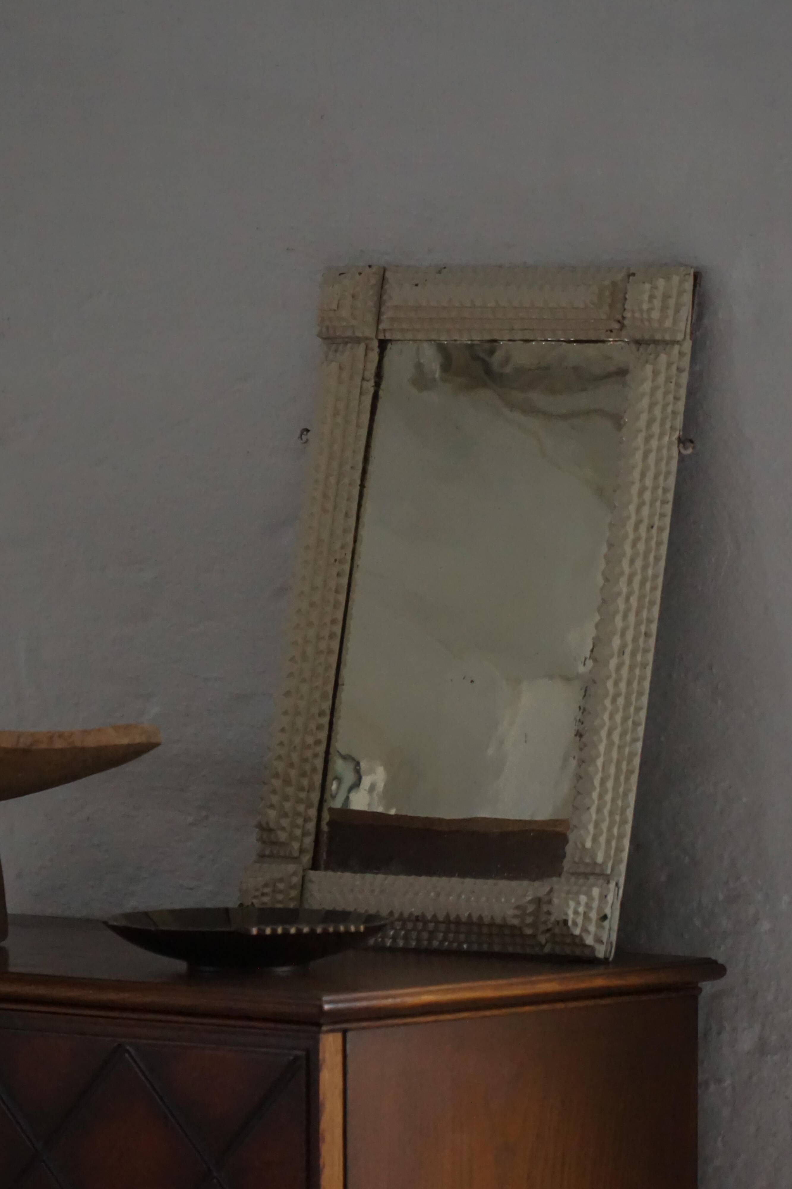 Wall mirror in tramp art style, hand-carved with a painted white frame, early 1900s.