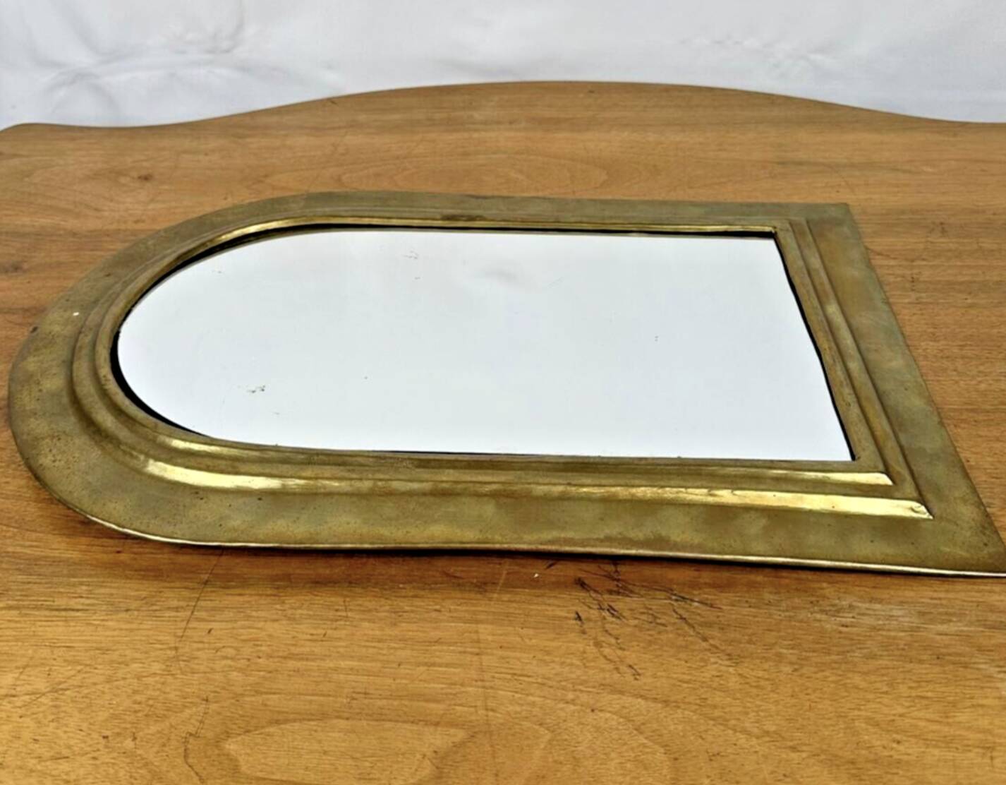 Vintage golden half-moon mirror