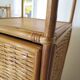 Storage column, wooden bookshelf and woven rattan.