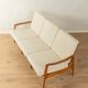 Elegant mid-century sofa from the 1960s with cream-white upholstery