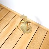 Brass heron head down