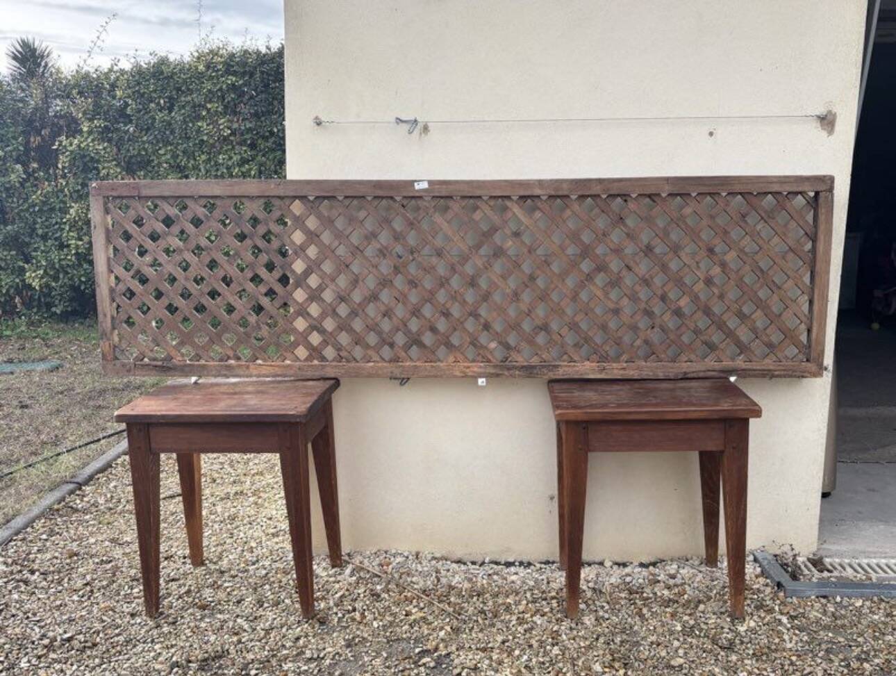 Headboard and its two wooden bedside tables.