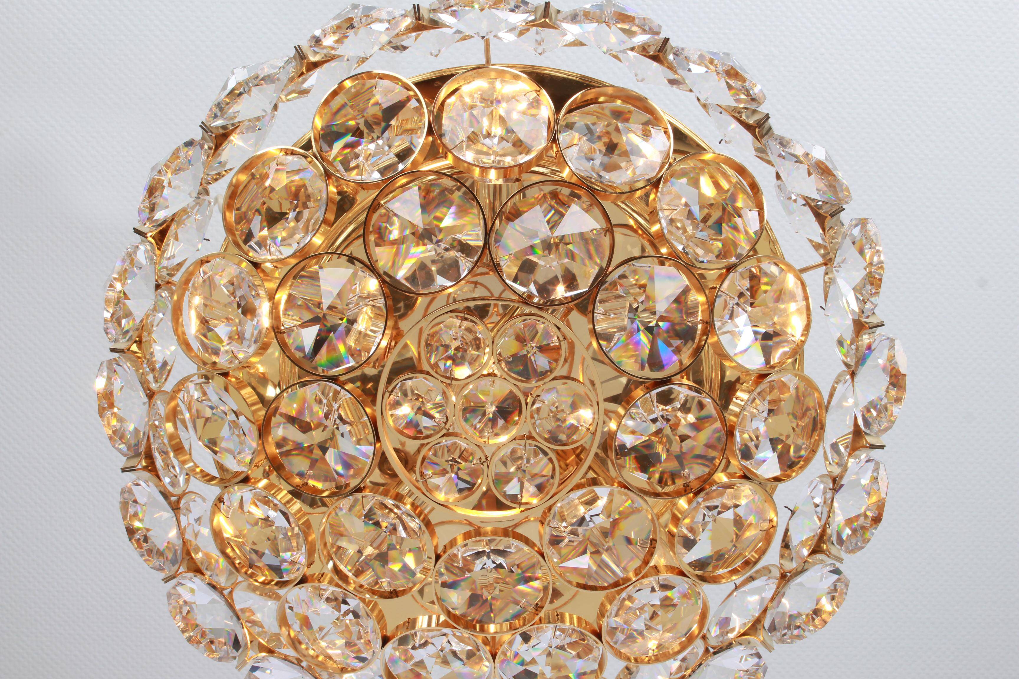 Chandelier in gilded brass and crystal glass inlaid by Palwa, Germany, 1970s.