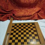 old wooden game board: small horses and checkers