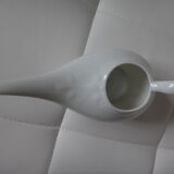 Old white porcelain pourer
