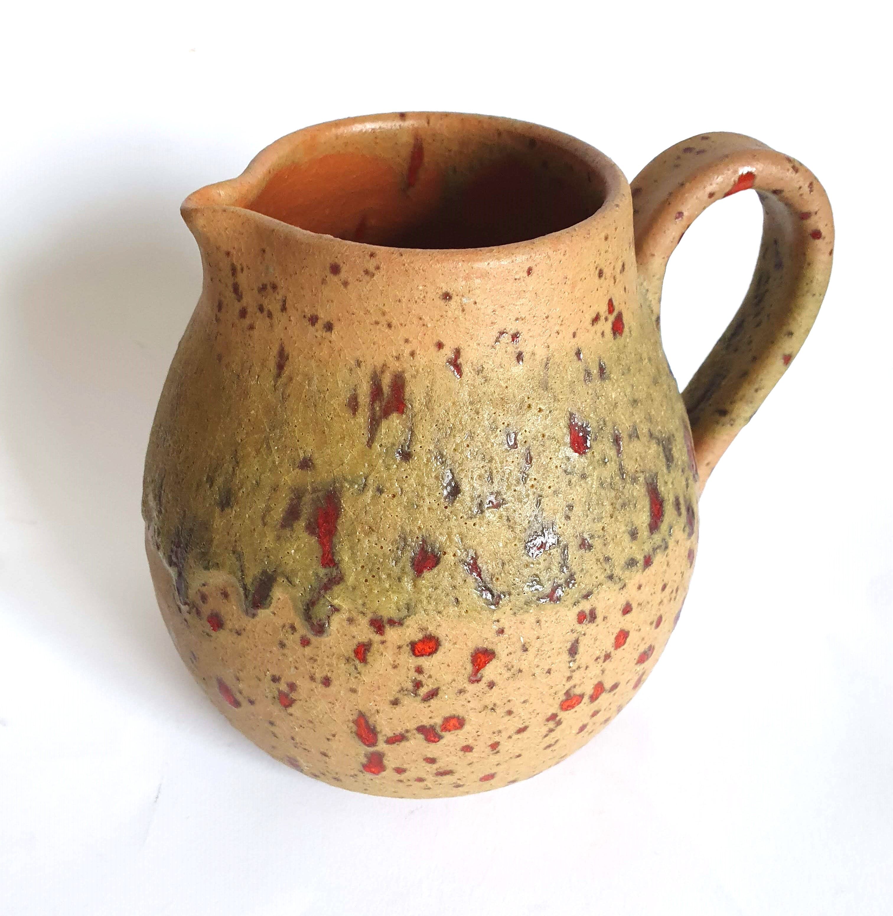 Red speckled stoneware pitcher by Campo Piano Orezza