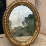 Oval mirror louis XVl with gilded cartouch, napoleon lll, XlXth high 106 cm