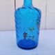 Vintage twisted blue glass carafe with enamel decoration.