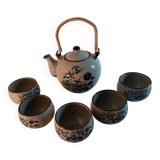 Tea service, teapot and five bowls in oriental style.