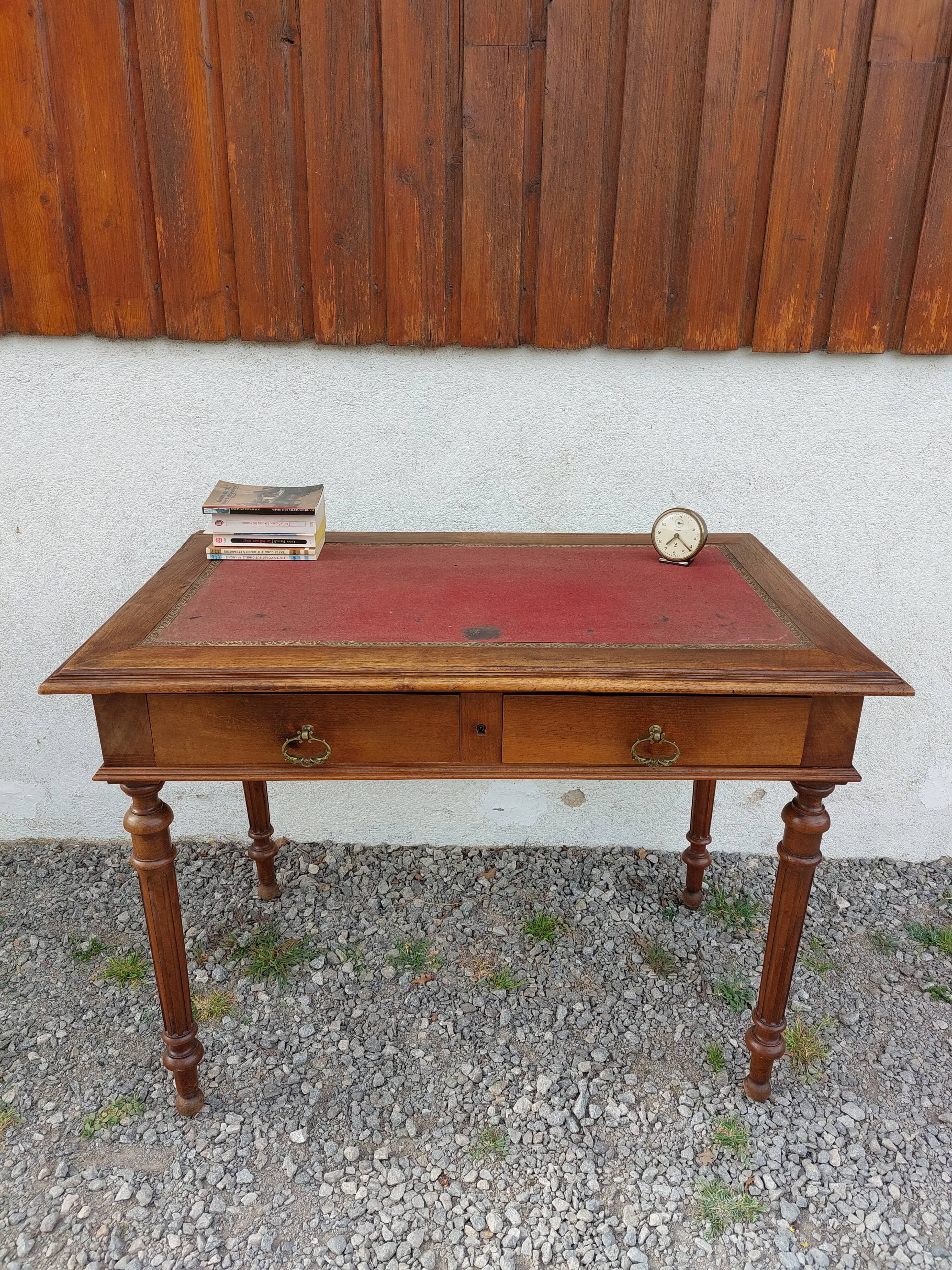 Old wooden desk, red felt top