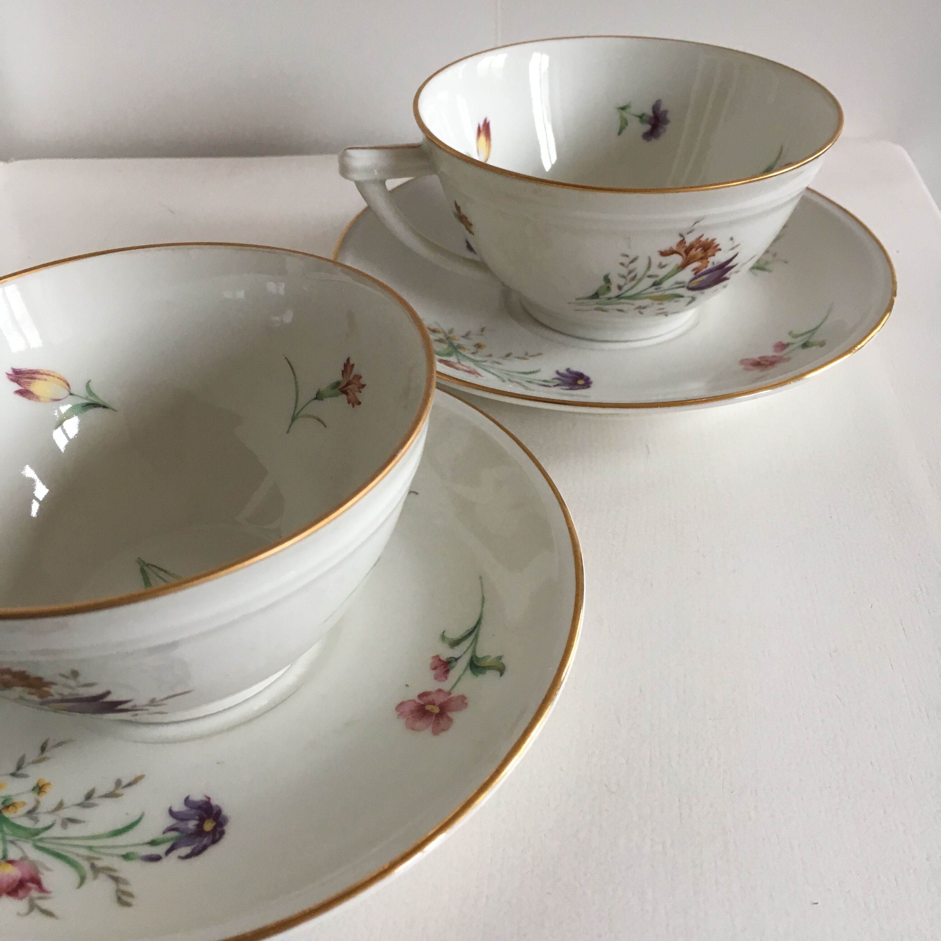 Duo of white Limoges porcelain cups with flowers