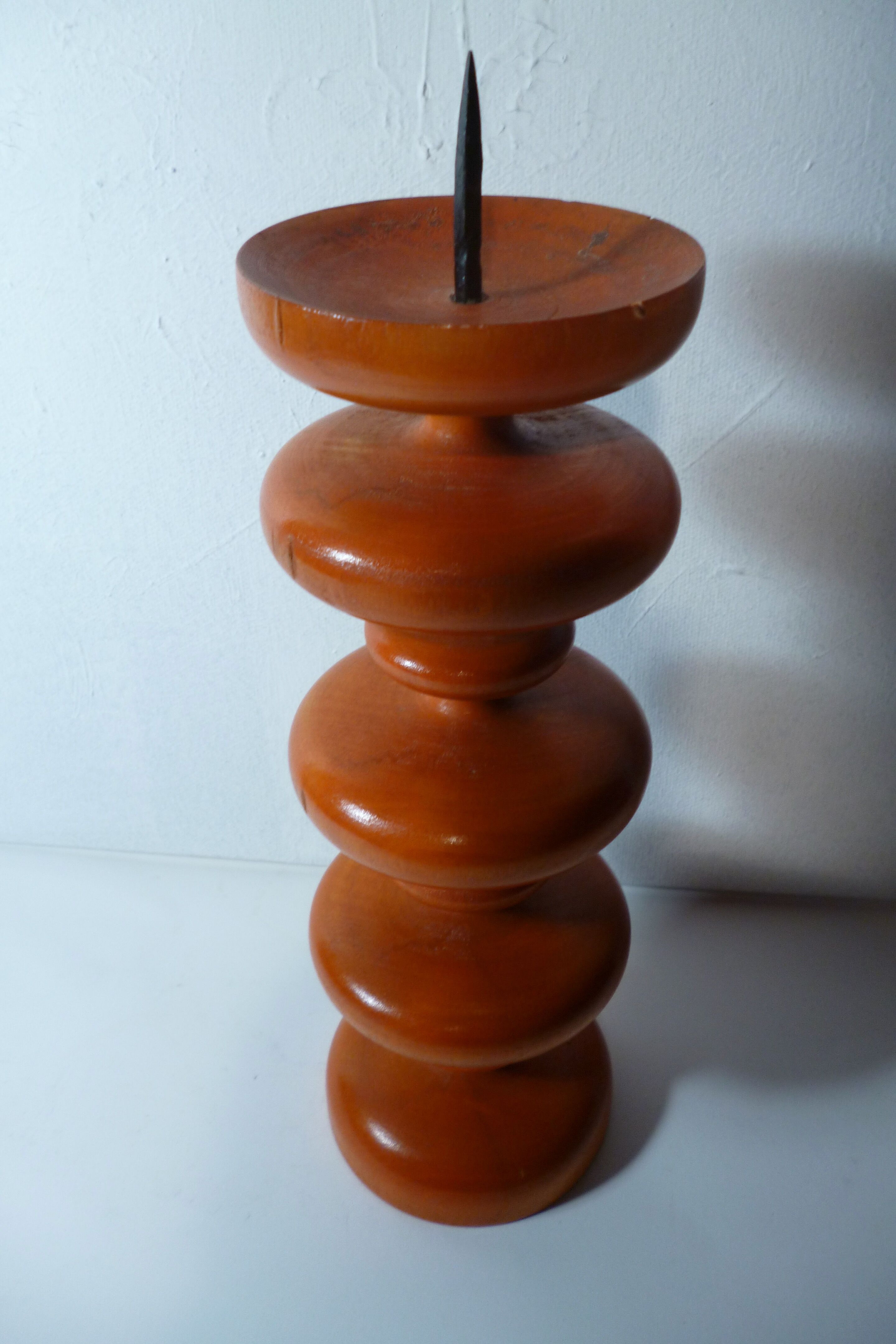 Vintage wooden candlestick turned orange